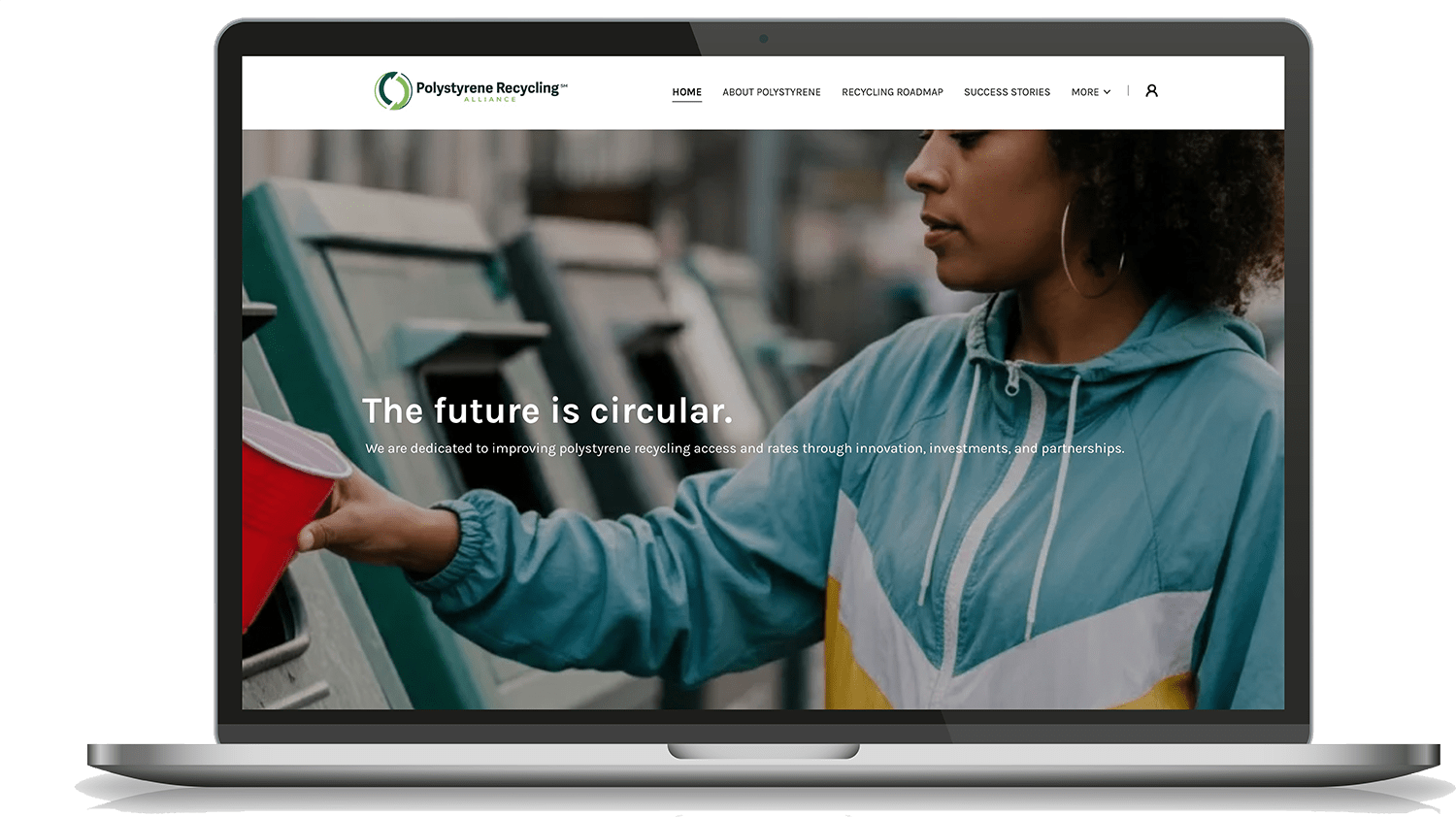 Computer screen shows website with woman recycling